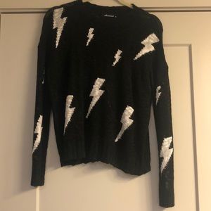 black sweater with lightning bolts